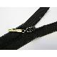 Zipper puller with laser effect