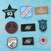 Embroidery badge with assorted fabric