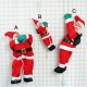 Climbing up Santa Claus with strings