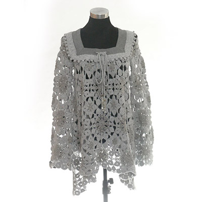 All over hand crochet with sewn on woven neck trim