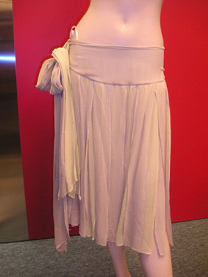 Silk stripes tapes skirt allover and with the bow tie at the side of the skirt.