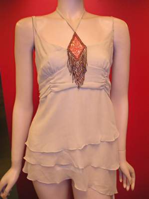 Silk beaded with diamond shape at the center front and layers body, top.