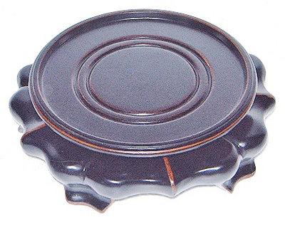 Carved Round Base In A Flower Pattern