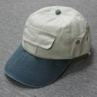 Adult 100% washed cotton peak cap. Pocket on front crown. Self strap with brass fastener.