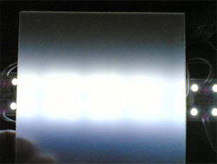 Light diffuser of high transmittance